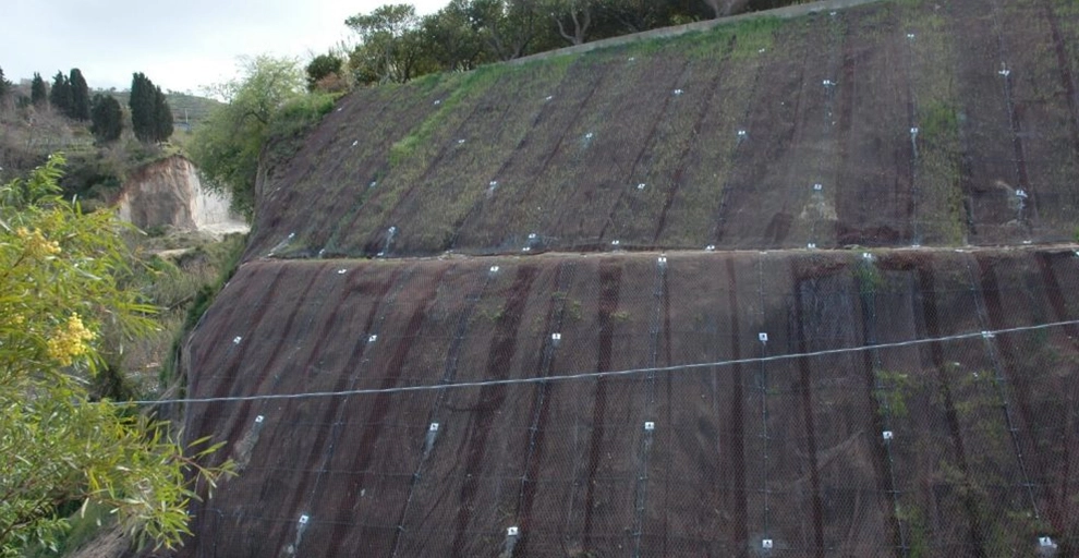 stock fencing on a slope